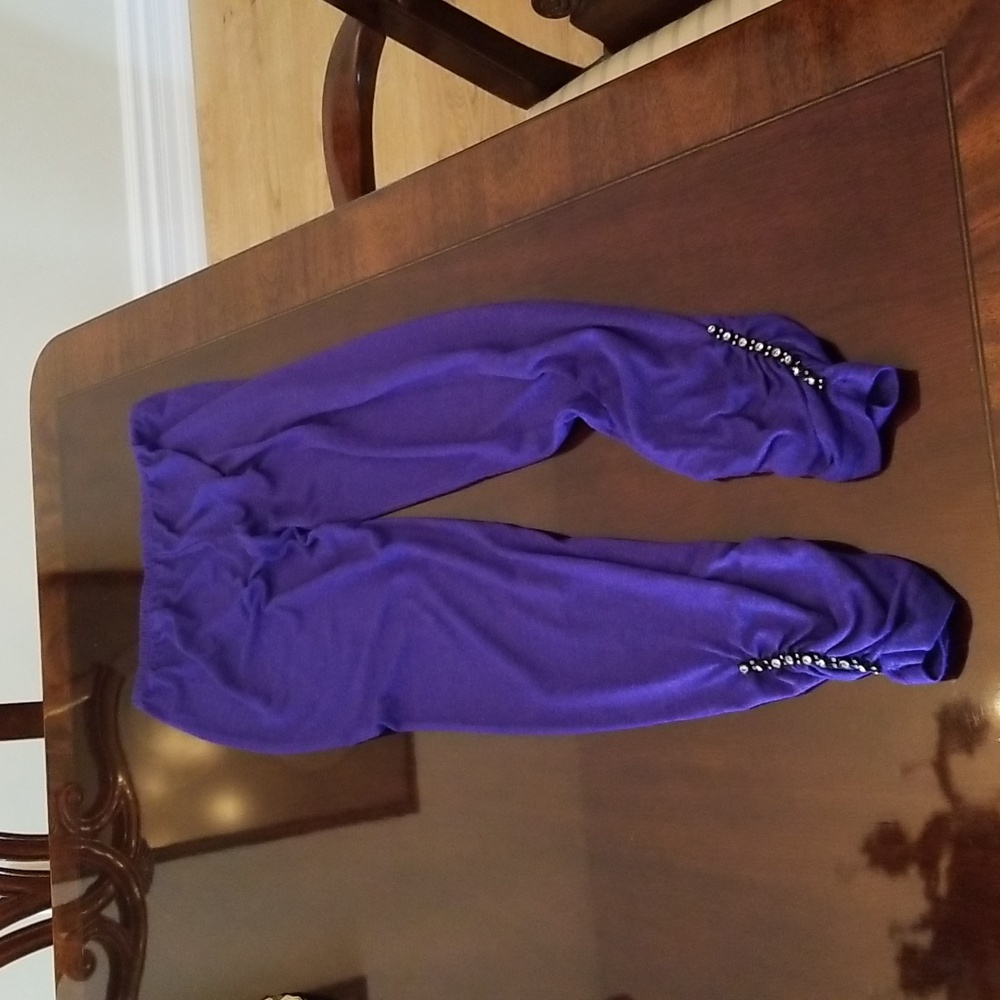 Bluish/purplish tights with Crystal's at the lower part. Small size